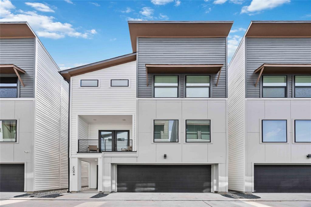 Three-story townhome with an attached 2-car garage on the first floor.Welcome Home