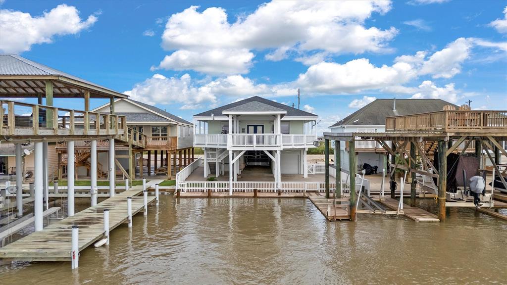 a view of a swimming pool with a patio and a yard