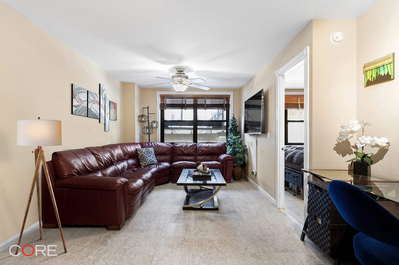 a living room with furniture and a large window