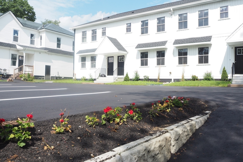 front view of a house and a yard