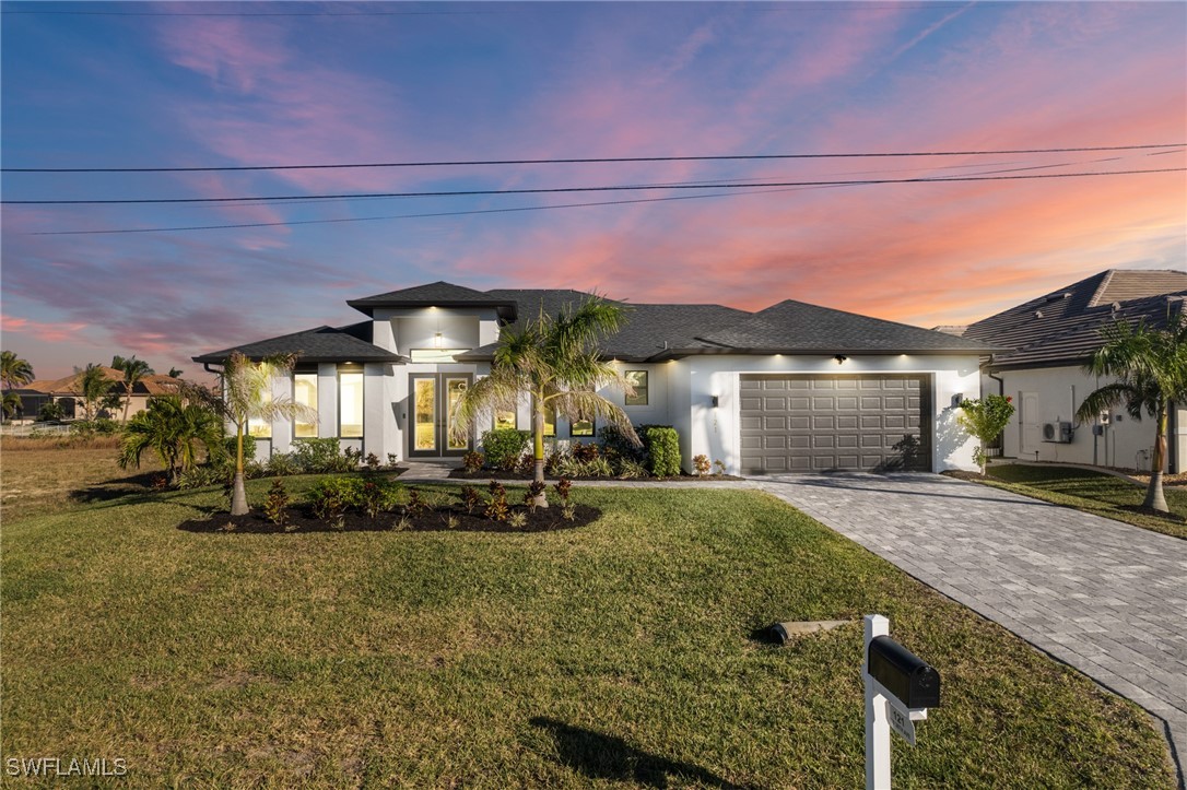 a view of a house with a yard