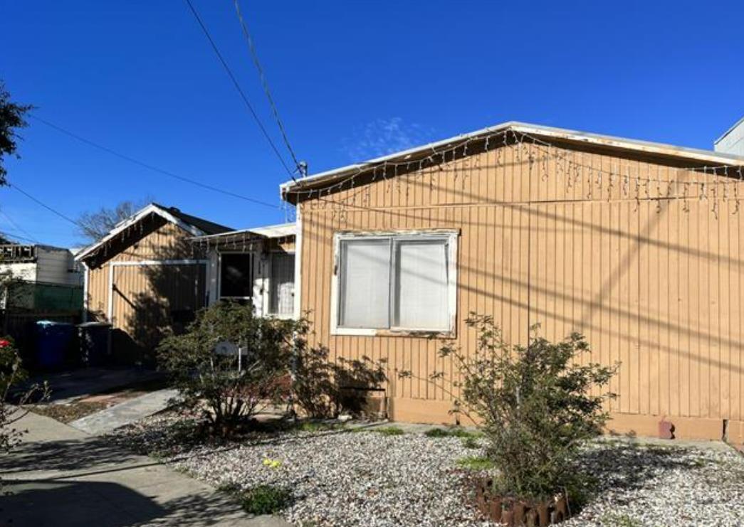 a view of a house with a small yard