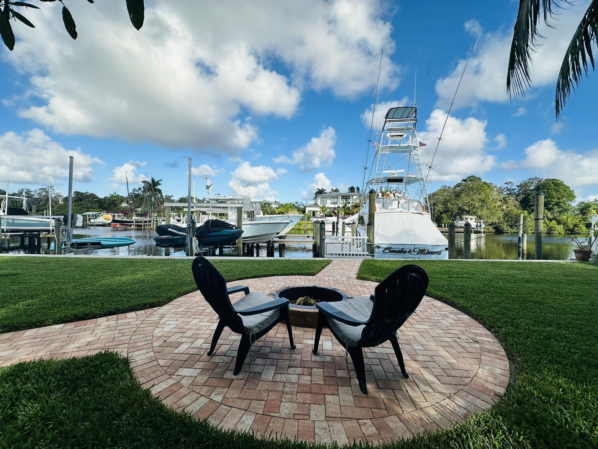 a view of a chairs in backyard of the house