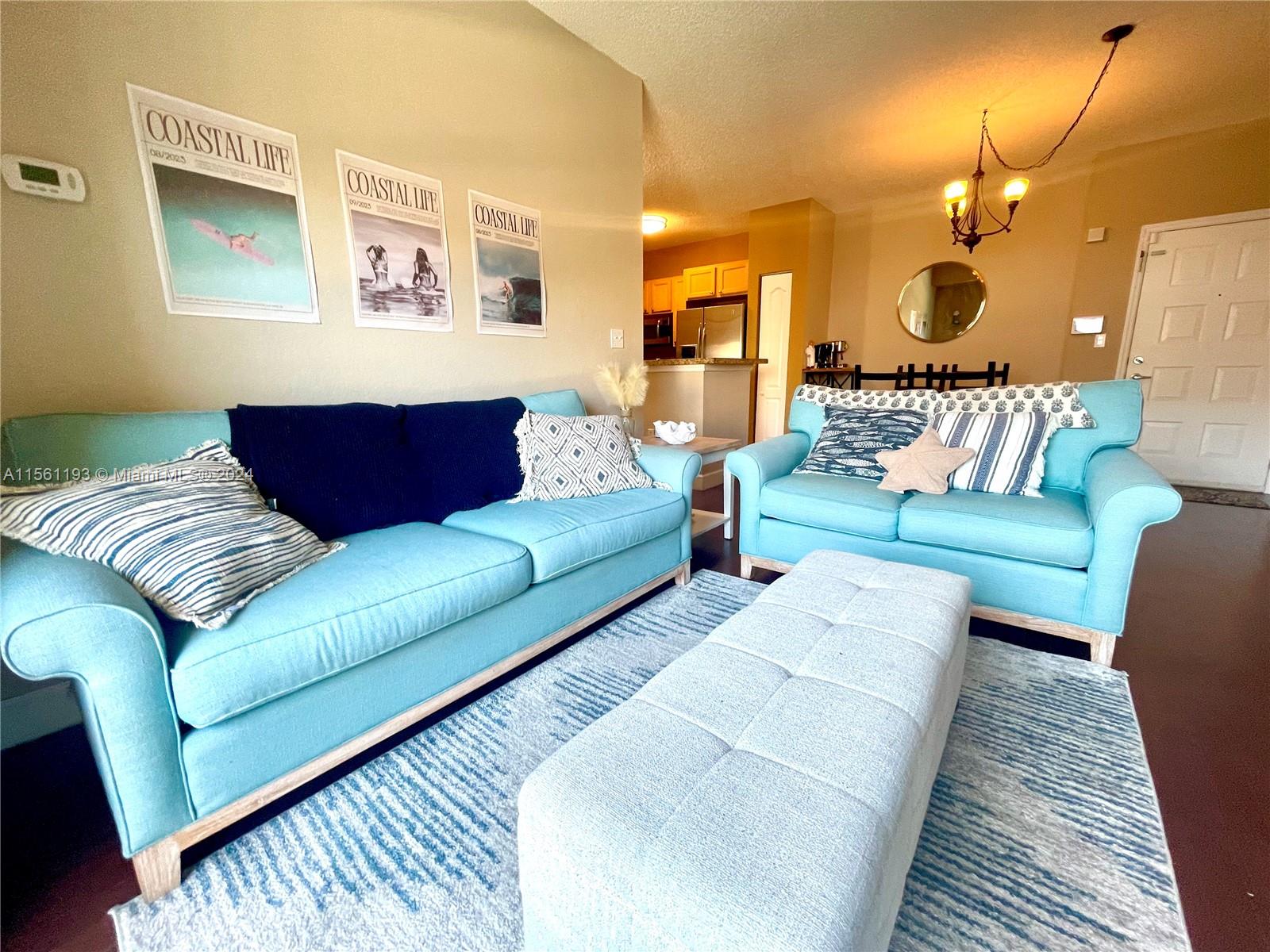 a living room with furniture and a rug