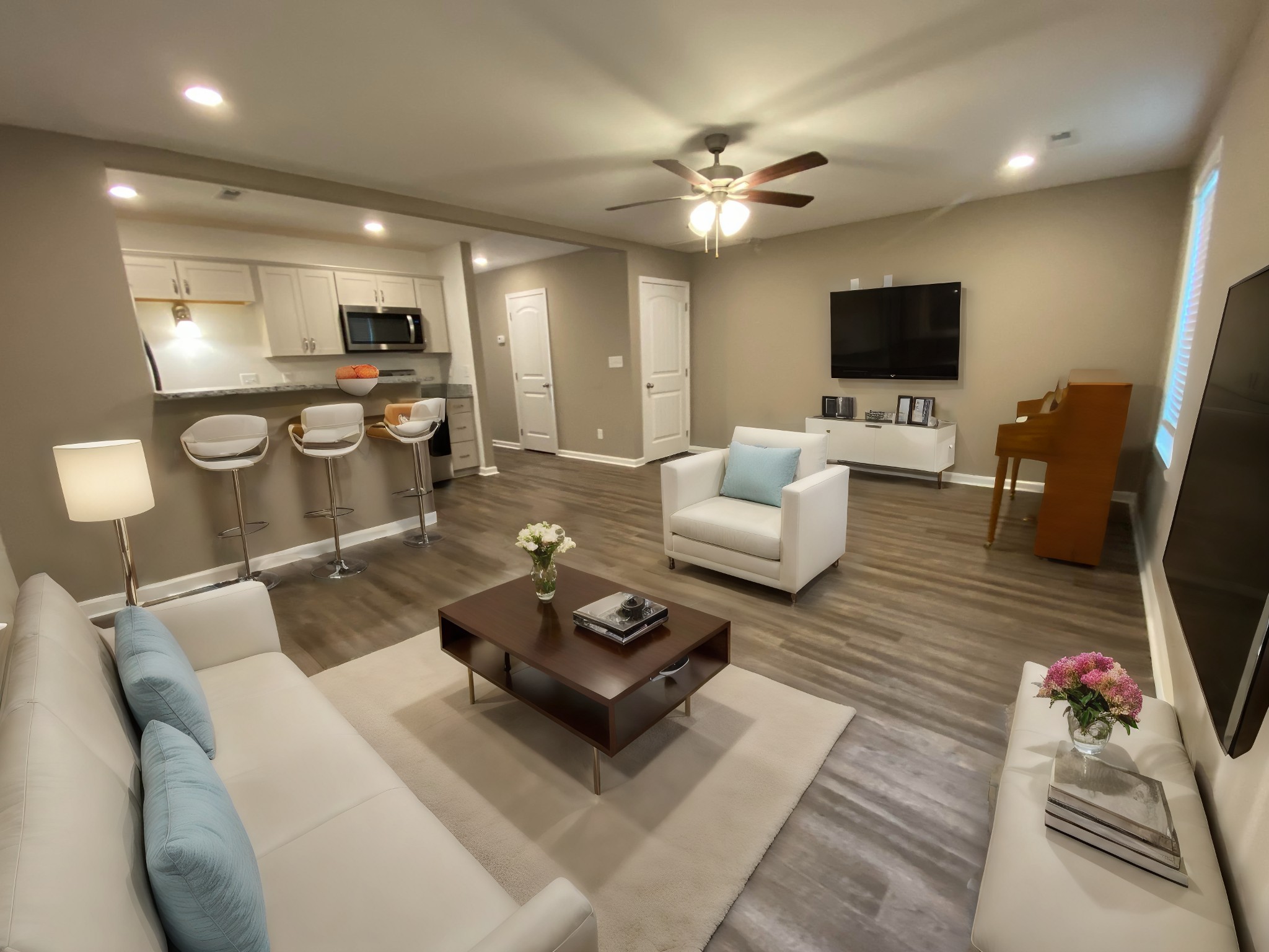 a living room with furniture and a flat screen tv