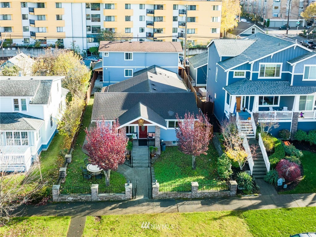 an aerial view of multiple houses with swimming pool