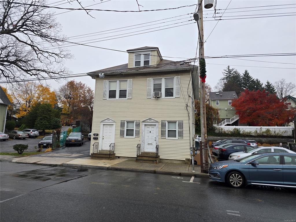 a view of a car parked in front of a house