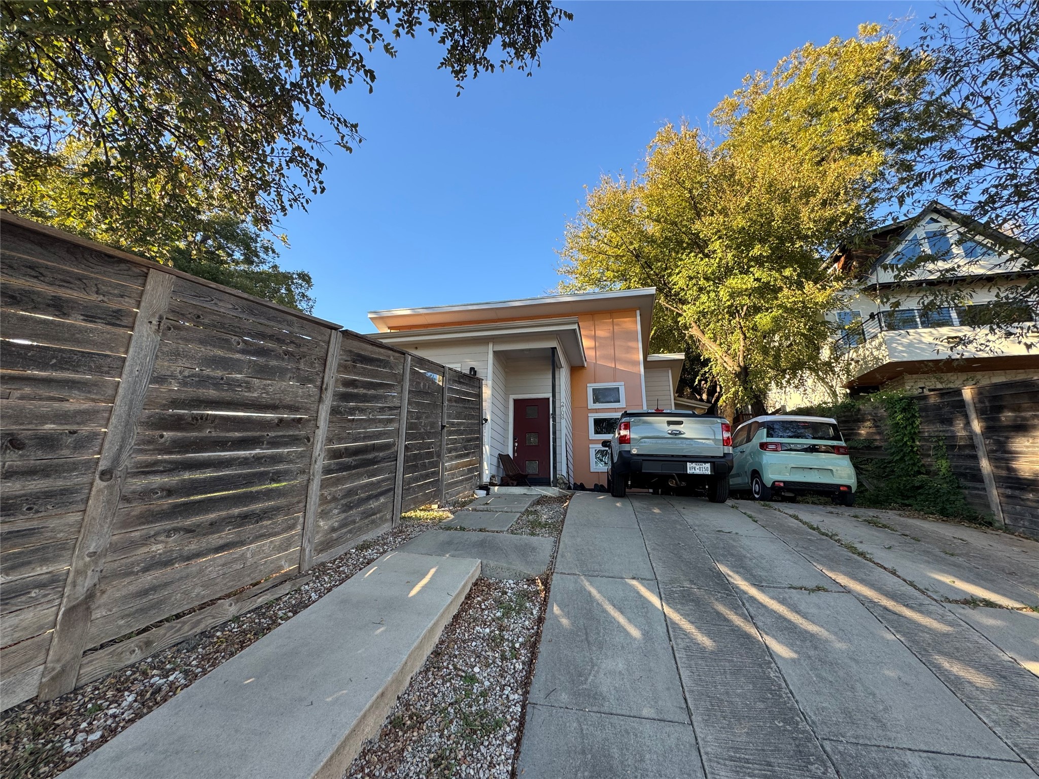 a view of a car park in front of house