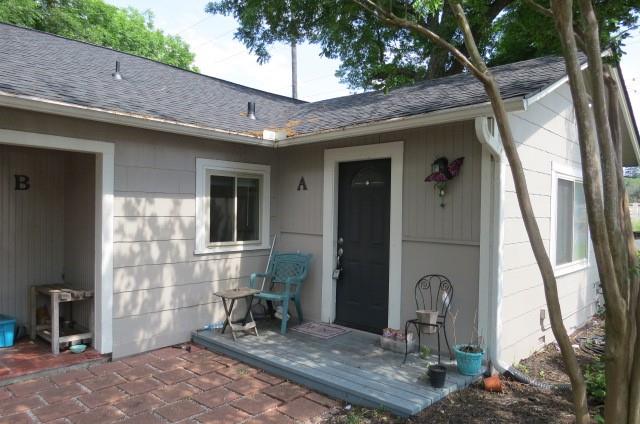 a front view of a house with outdoor seating