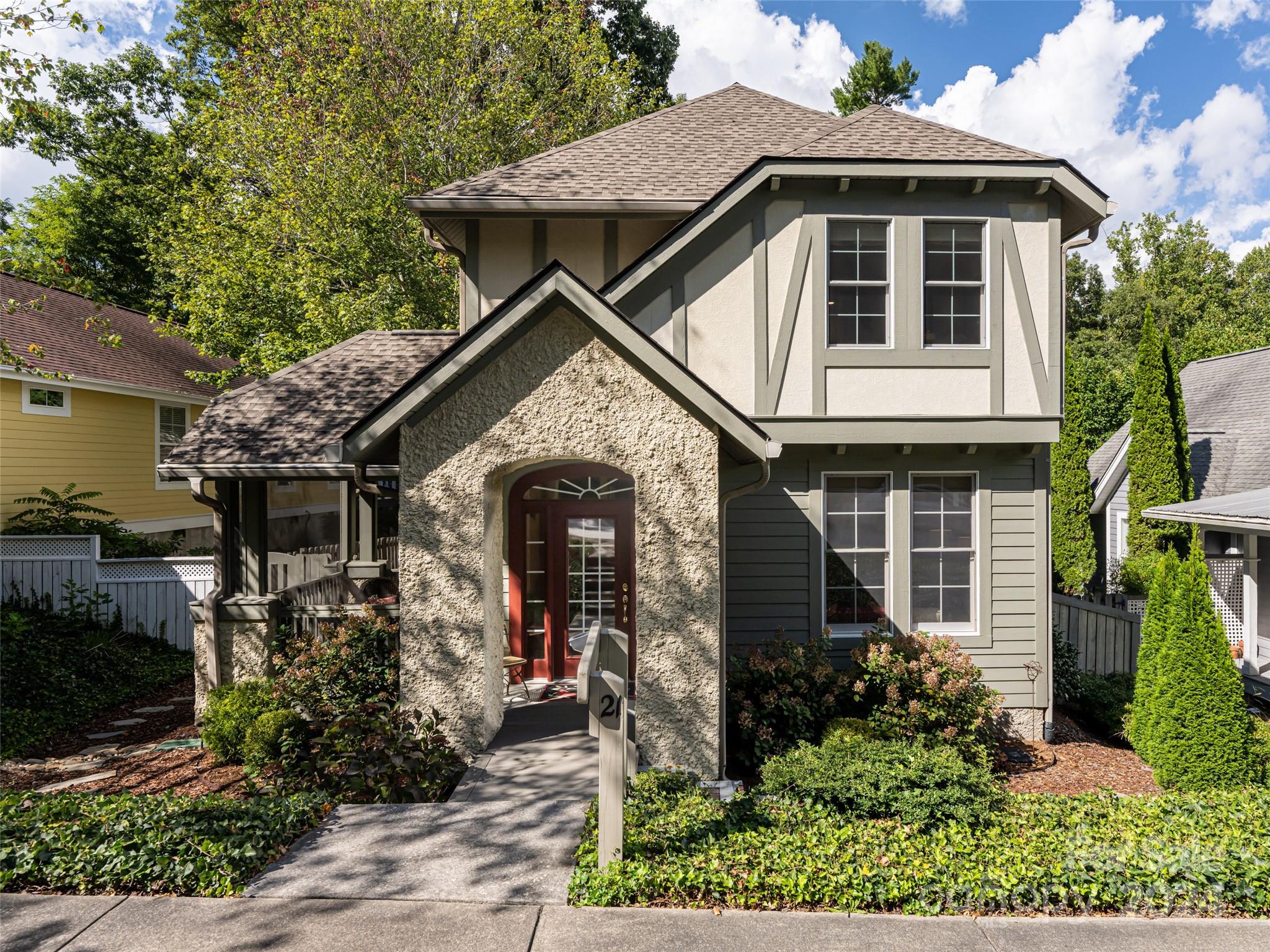 a front view of a house with garden