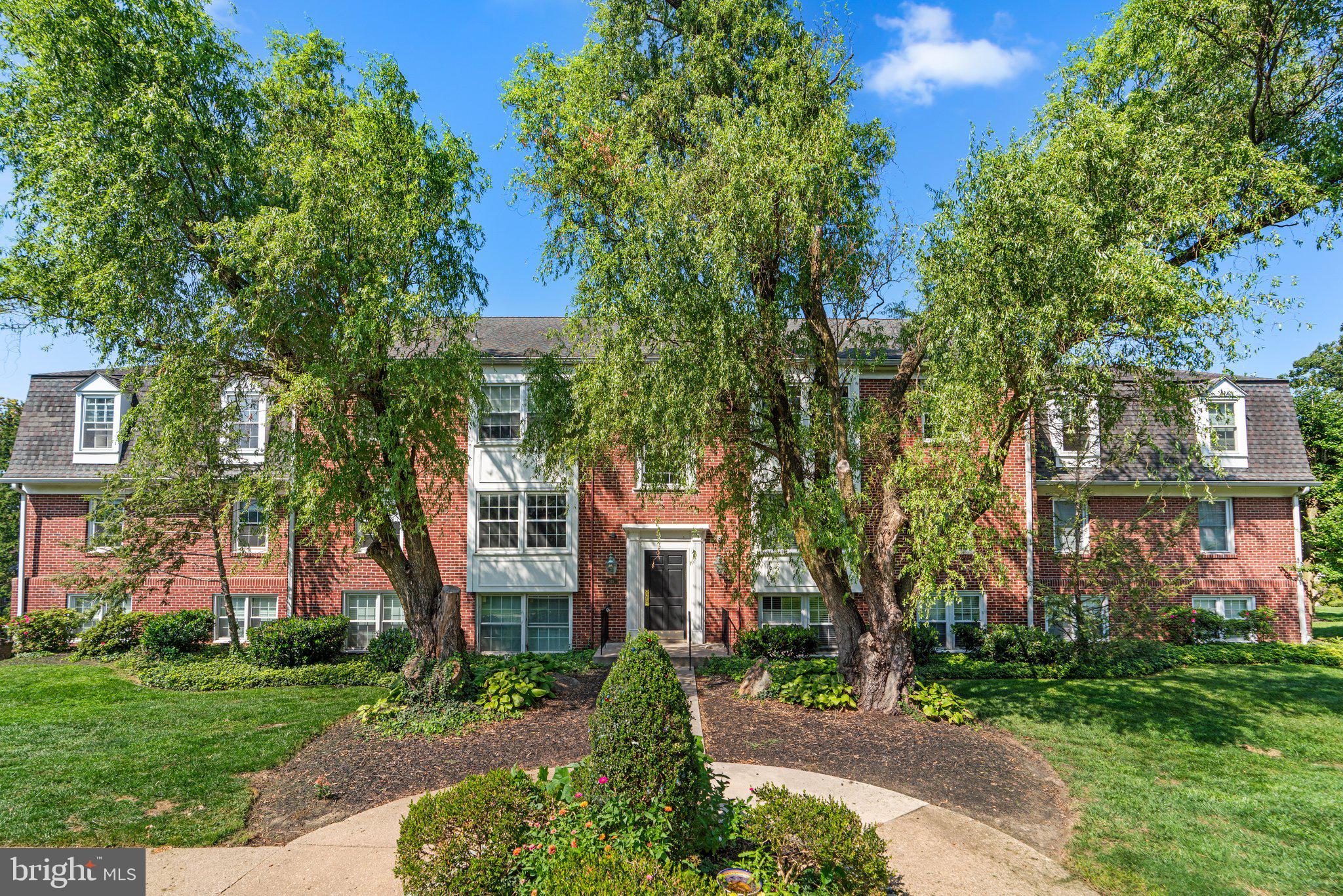 front view of a house with a garden