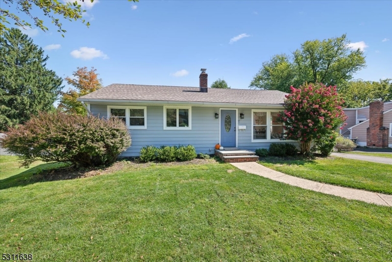 front view of a house next to a yard