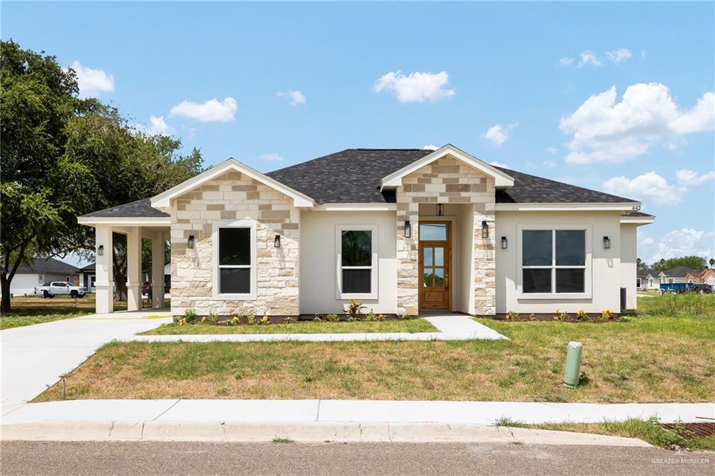 View of front of home featuring a front lawn