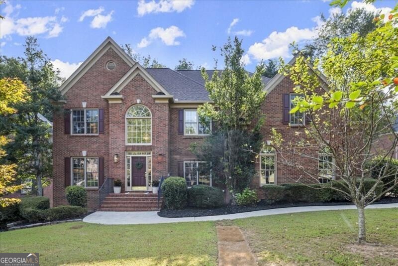 front view of a house with a yard