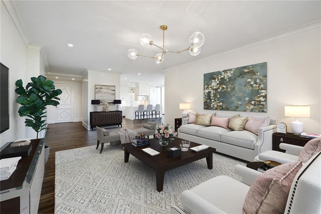 a living room with furniture or kitchen and a chandelier