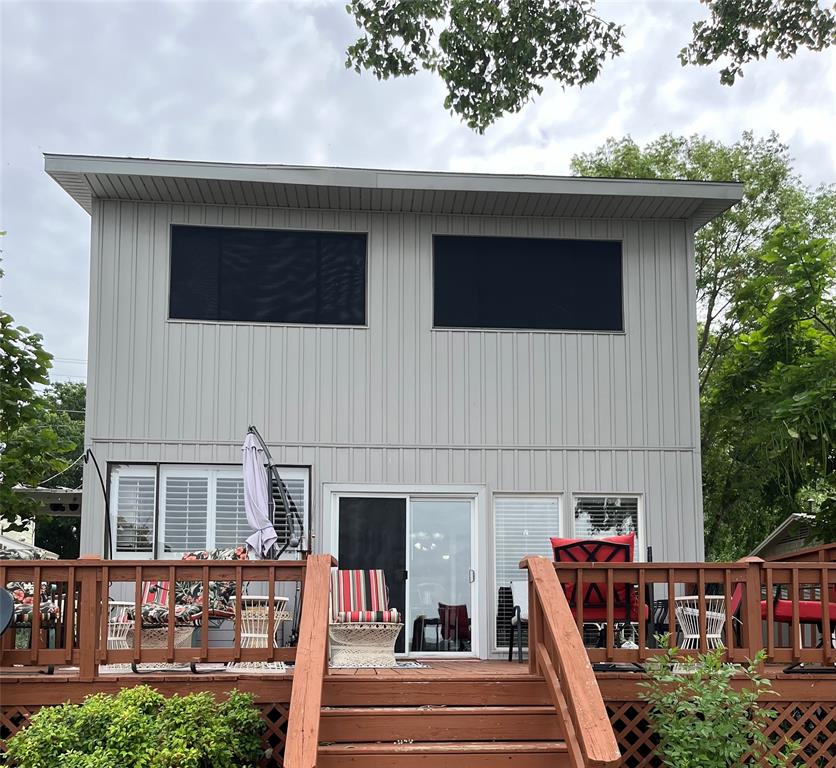 a front view of a house with outdoor seating