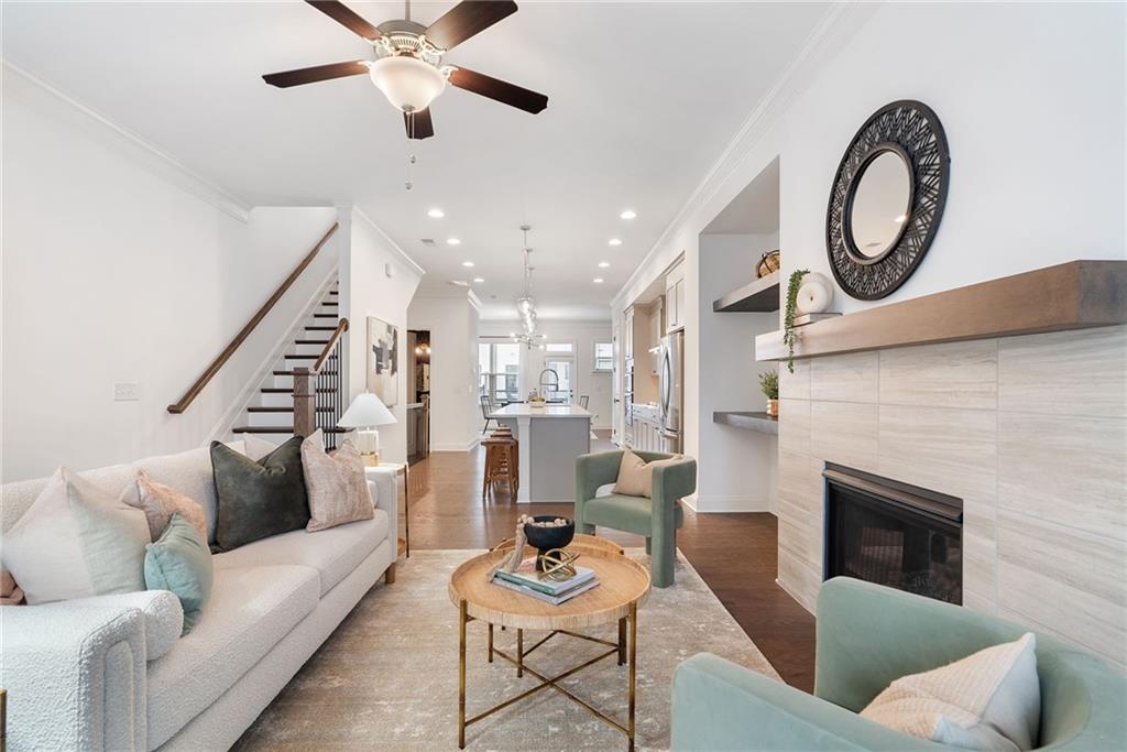 a living room with furniture and a fireplace