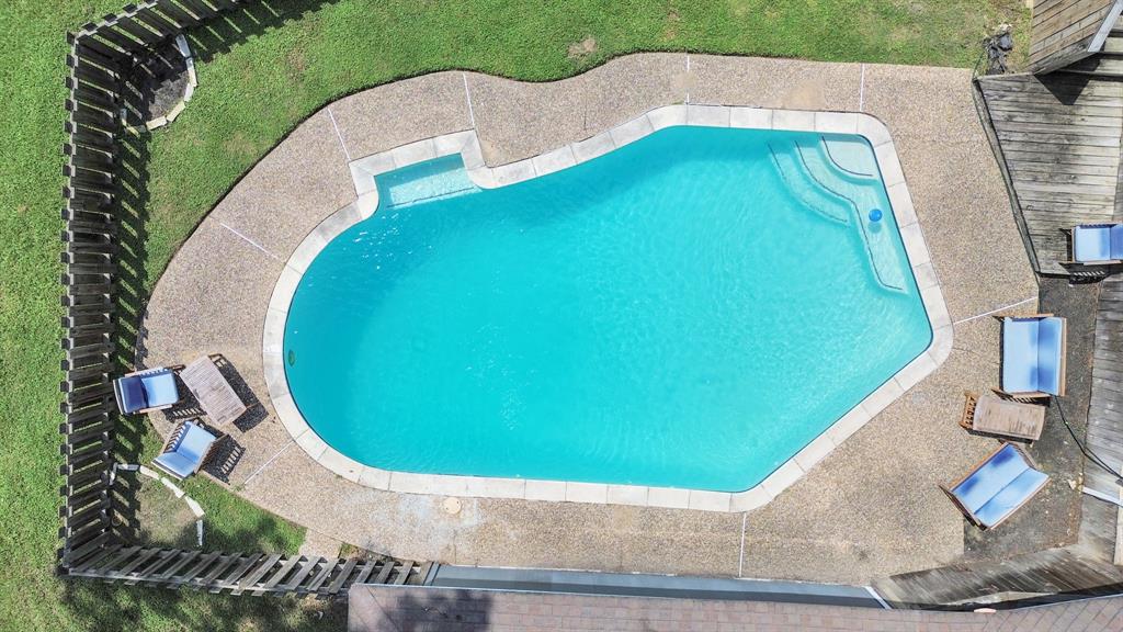 an aerial view of a swimming pool