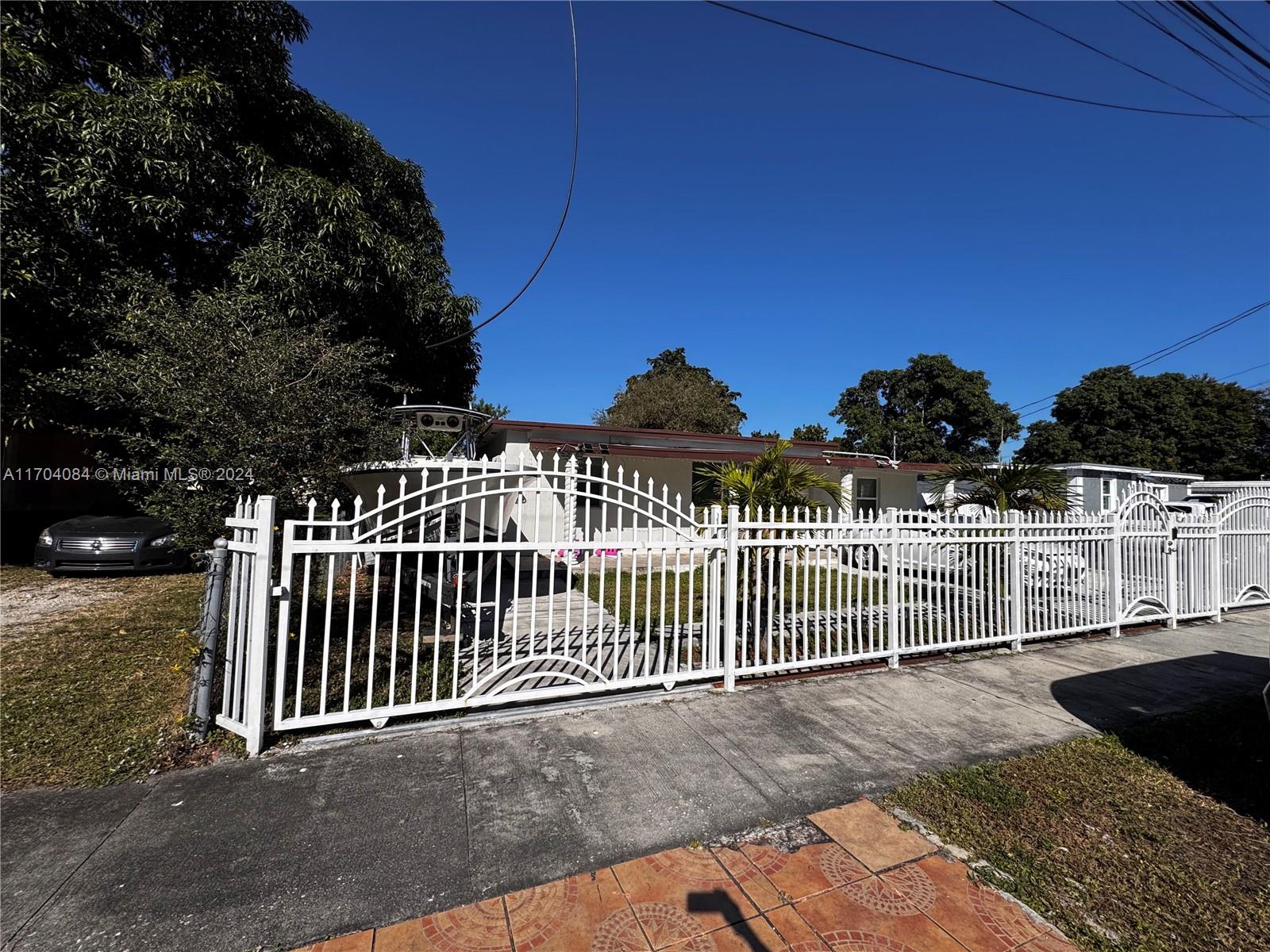 a view of a wrought iron fences in front of house