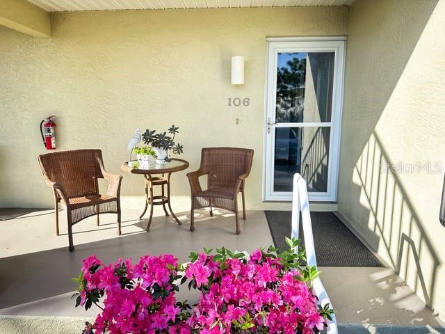 a view of livingroom with furniture and flowers