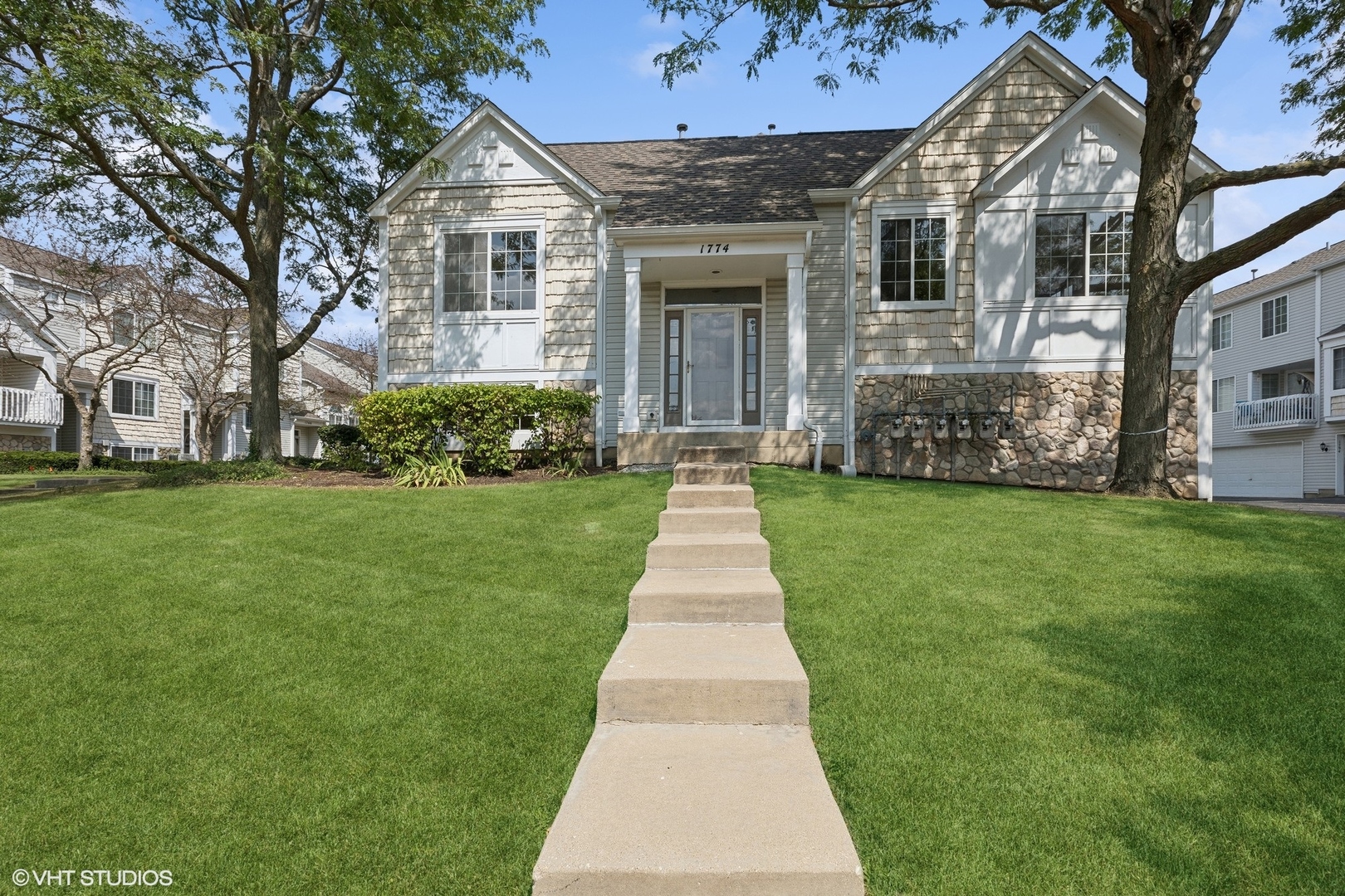 a front view of a house with a yard