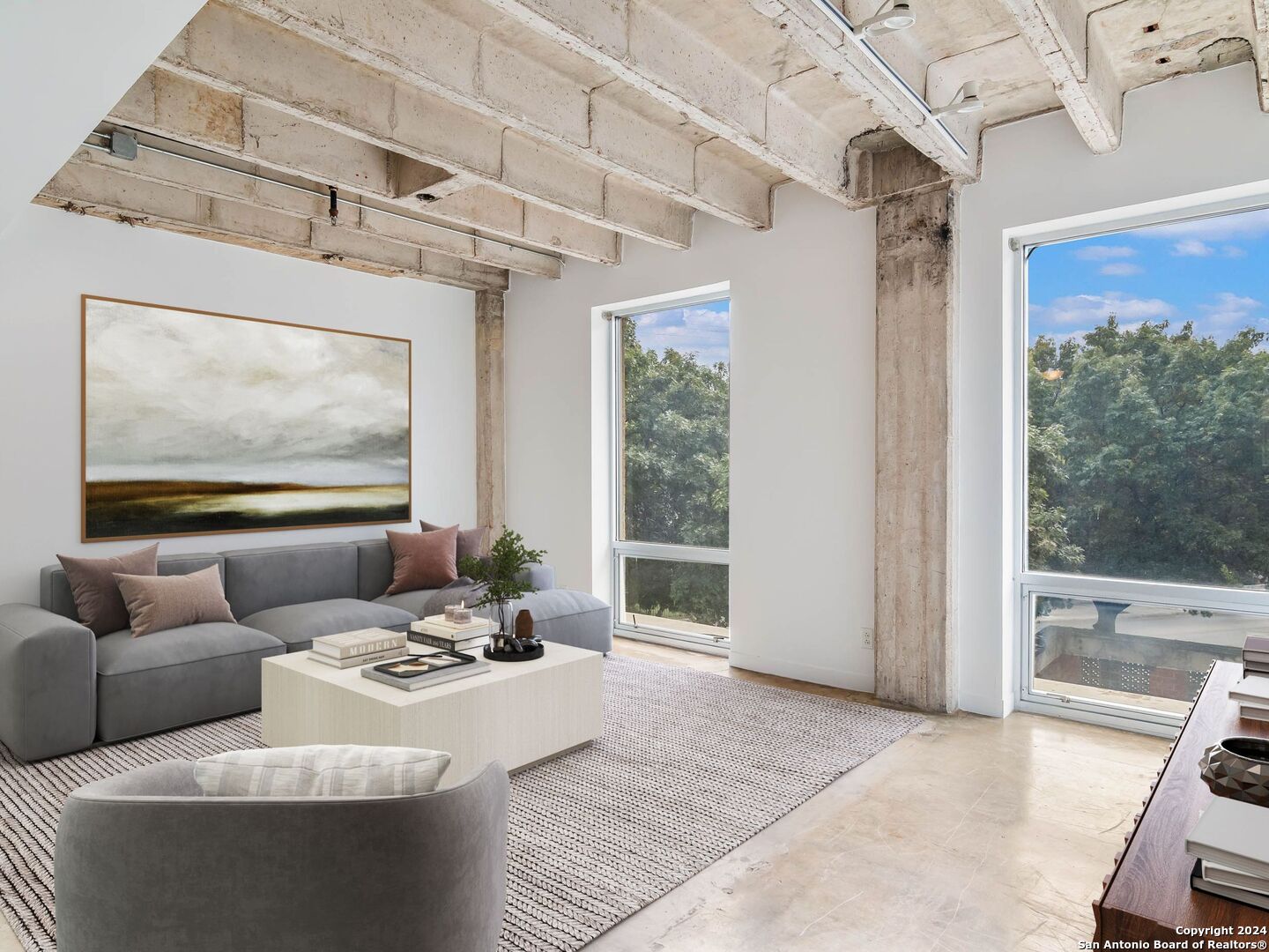 a living room with furniture and a large window