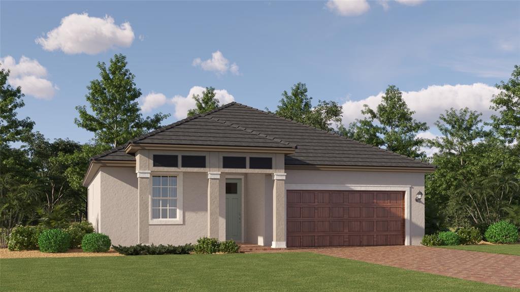 a front view of a house with a yard and garage