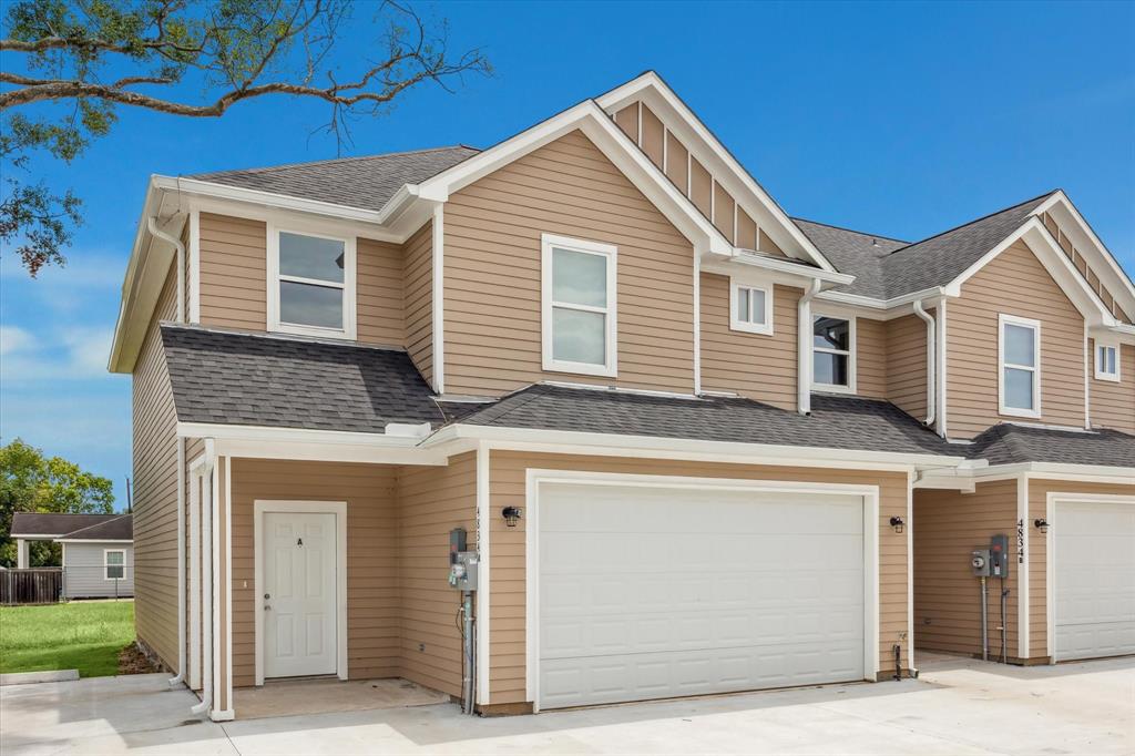 a front view of a house with a garage