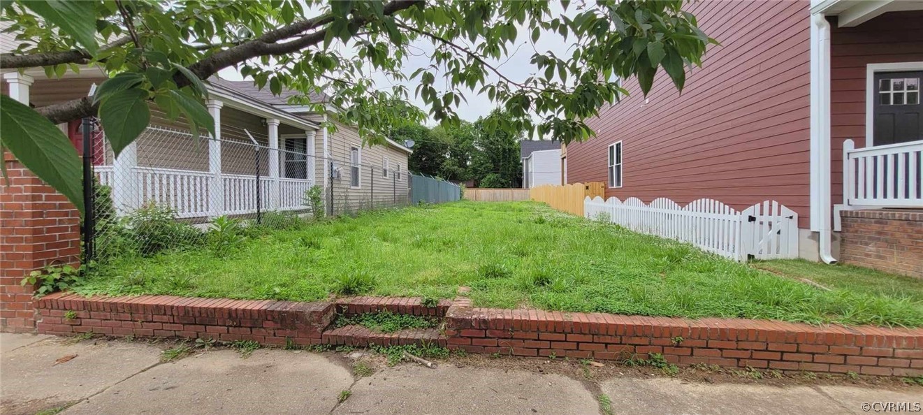 a backyard of a house with lots of green space