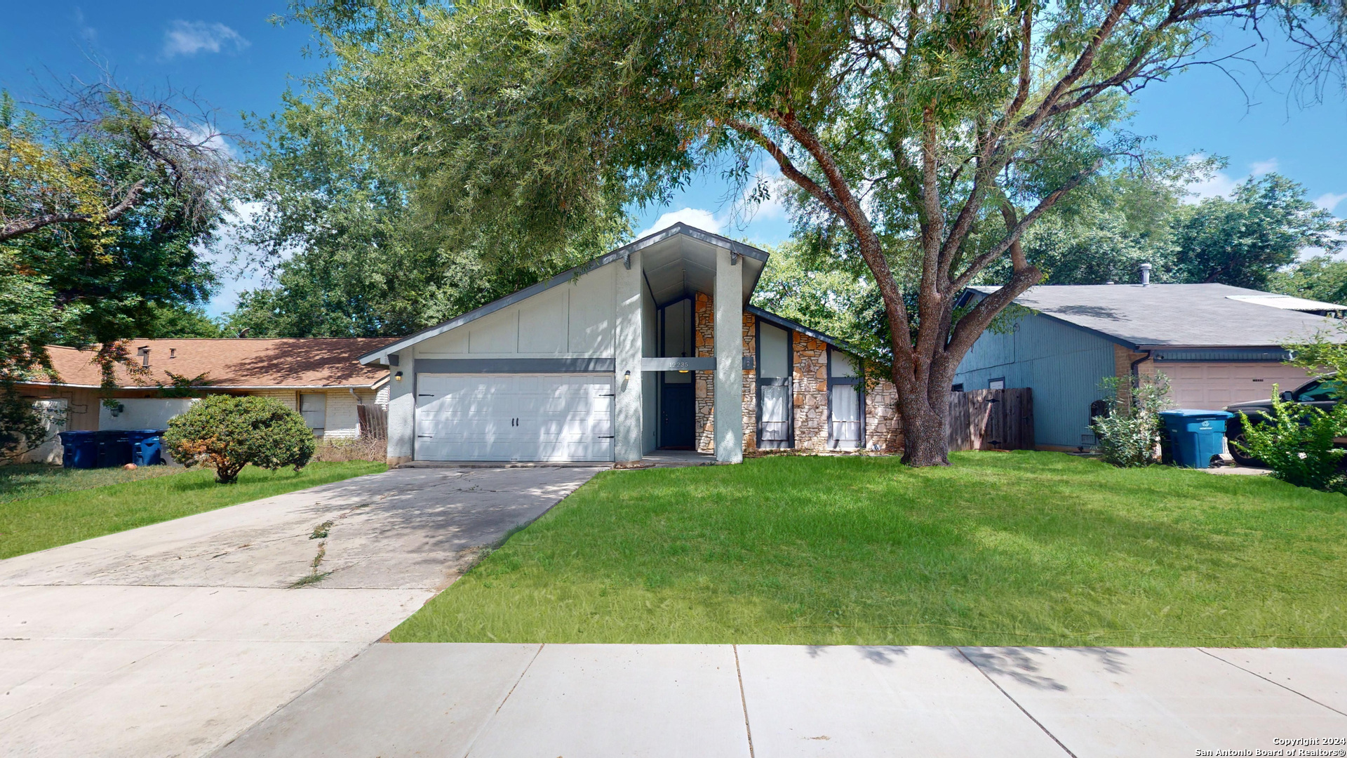 front view of a house with a yard