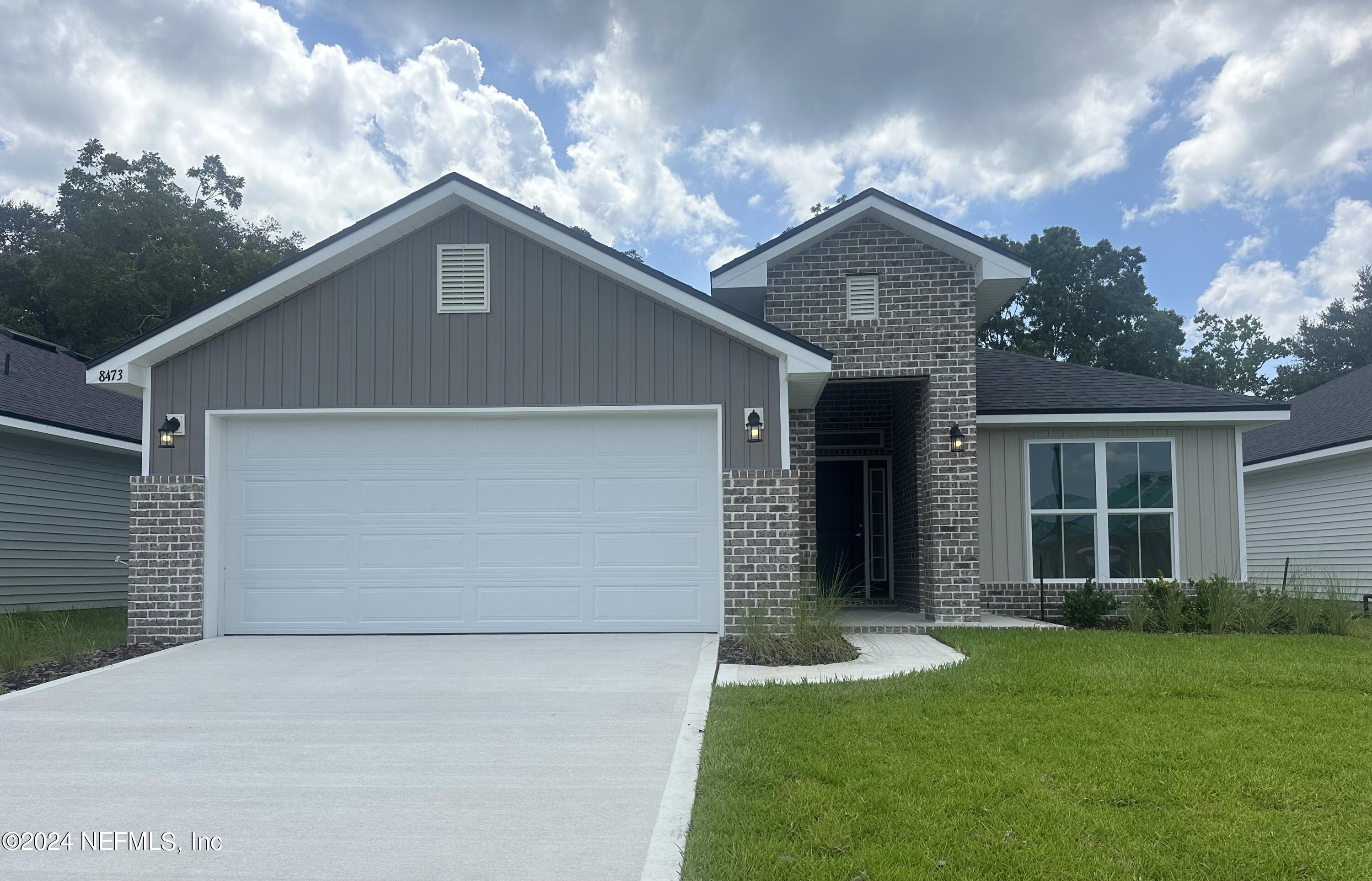 front view of house with a yard