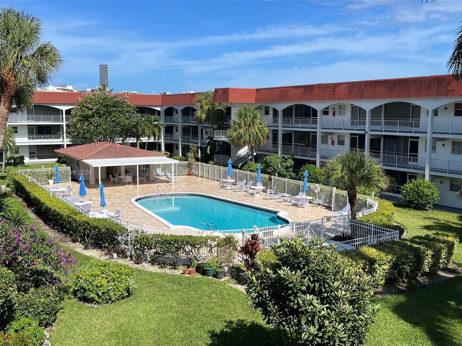 a view of a swimming pool with a garden