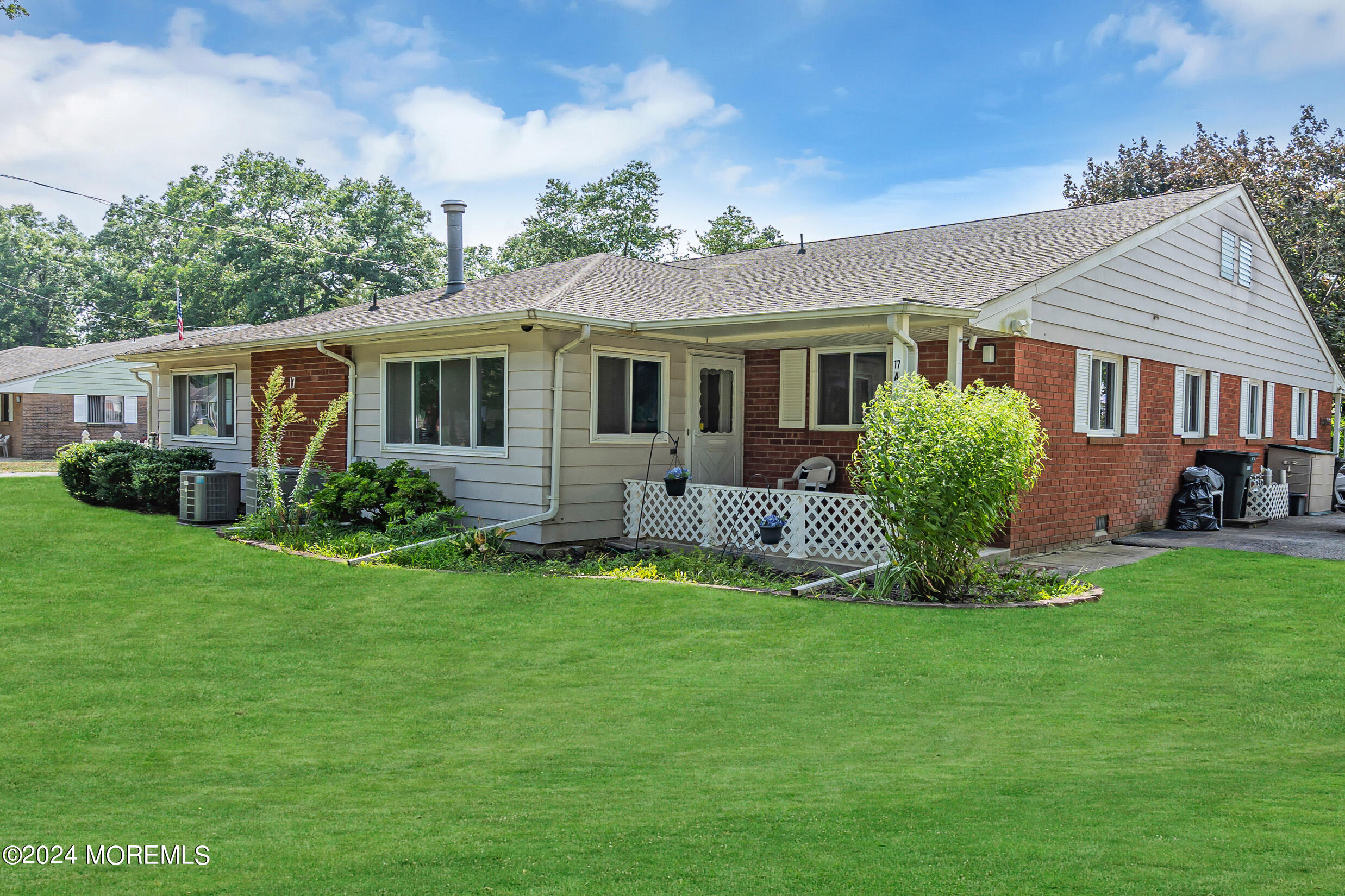 a view of a house with a yard and plants