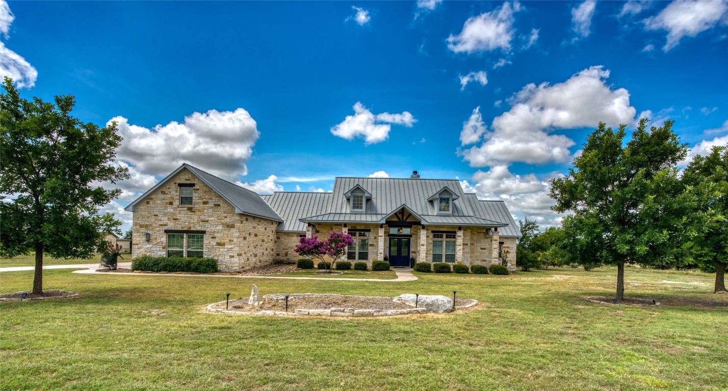 a view of a house with a big yard