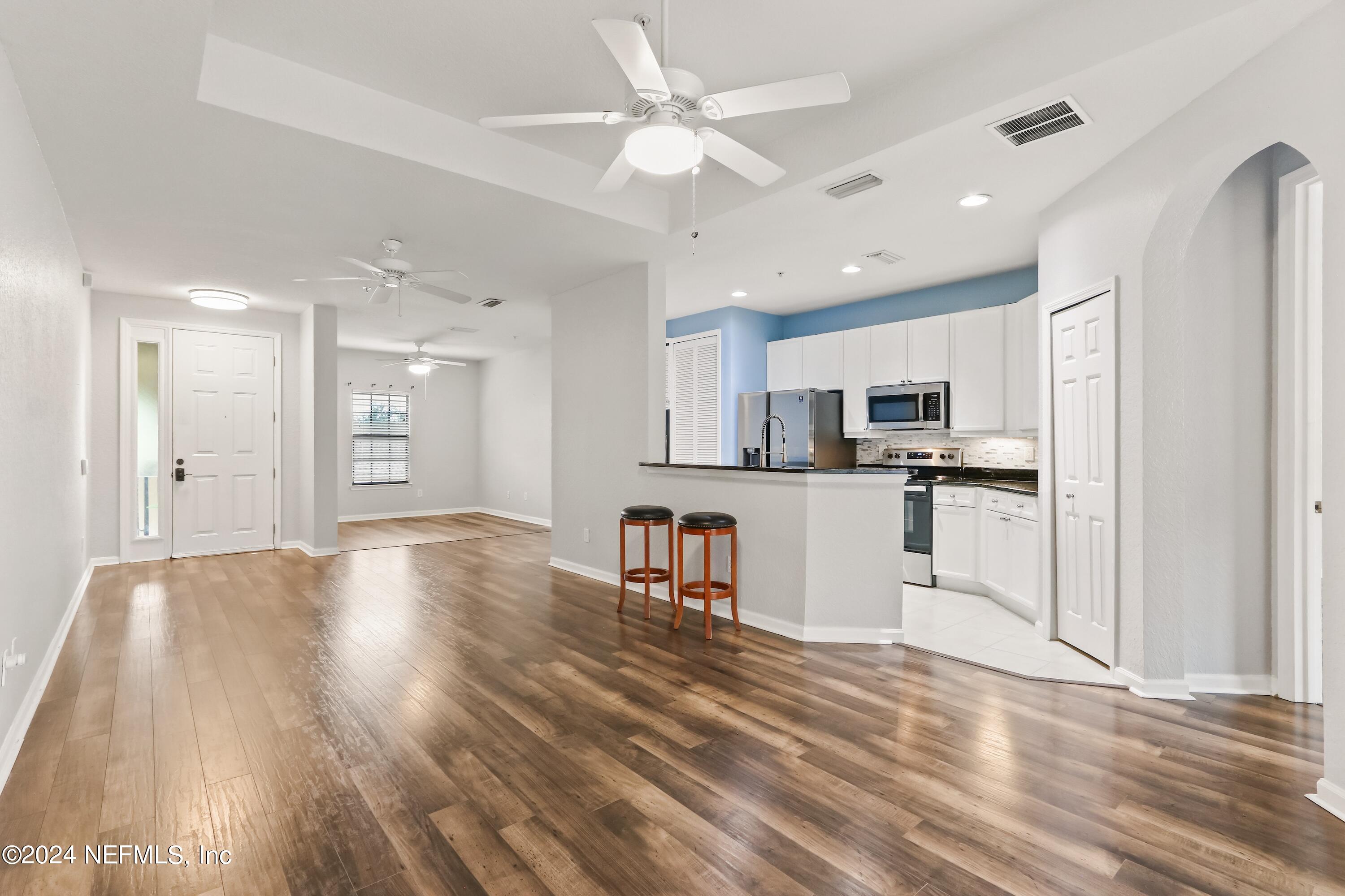 a view of kitchen with wooden floor