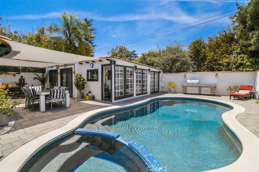 a view of a swimming pool with a patio