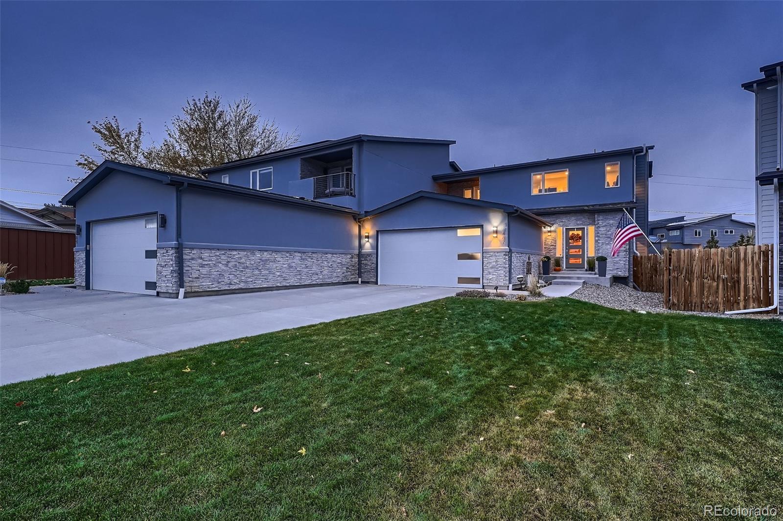 a view of a house with a backyard and a patio