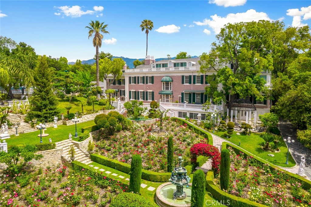 a view of a garden with an outdoor seating