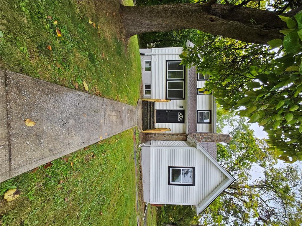 View of front of property with a front yard