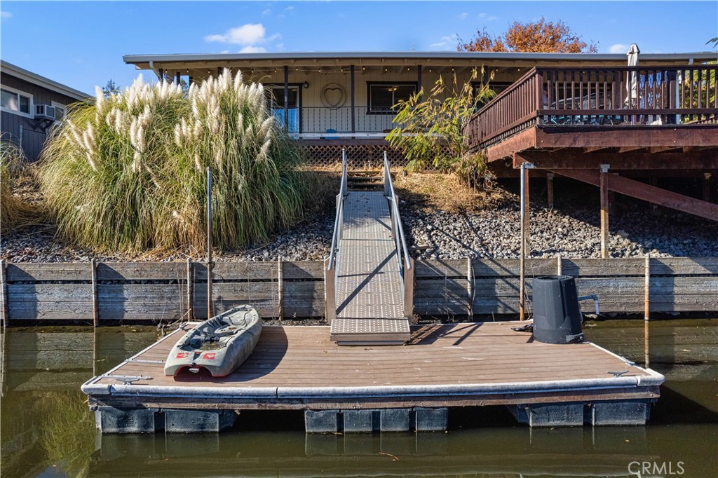 a view of a house with pool and sitting area