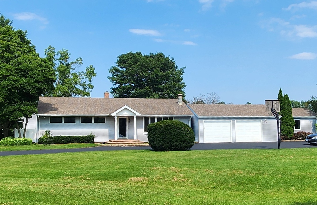 a view of a yard in front of a house