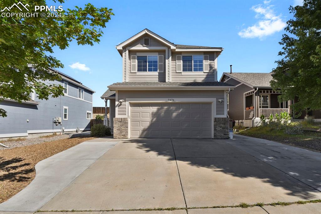 View of front facade with a garage