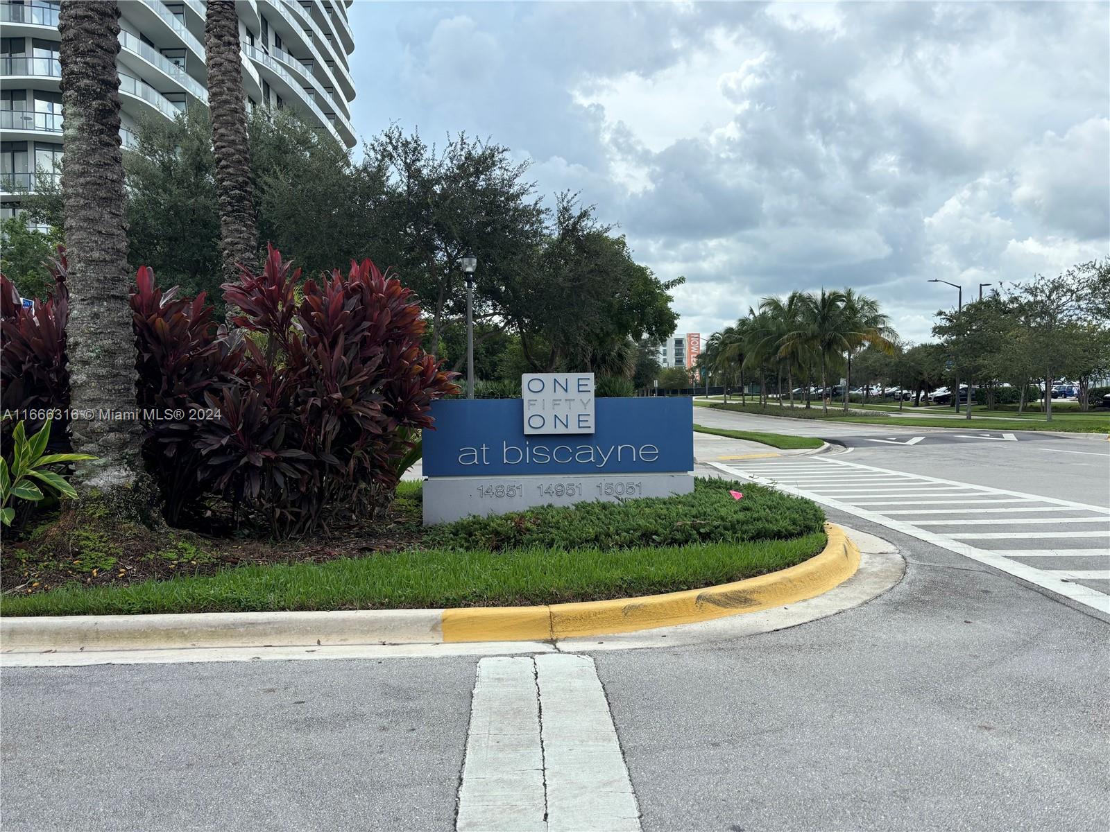 a view of a pathway with a park