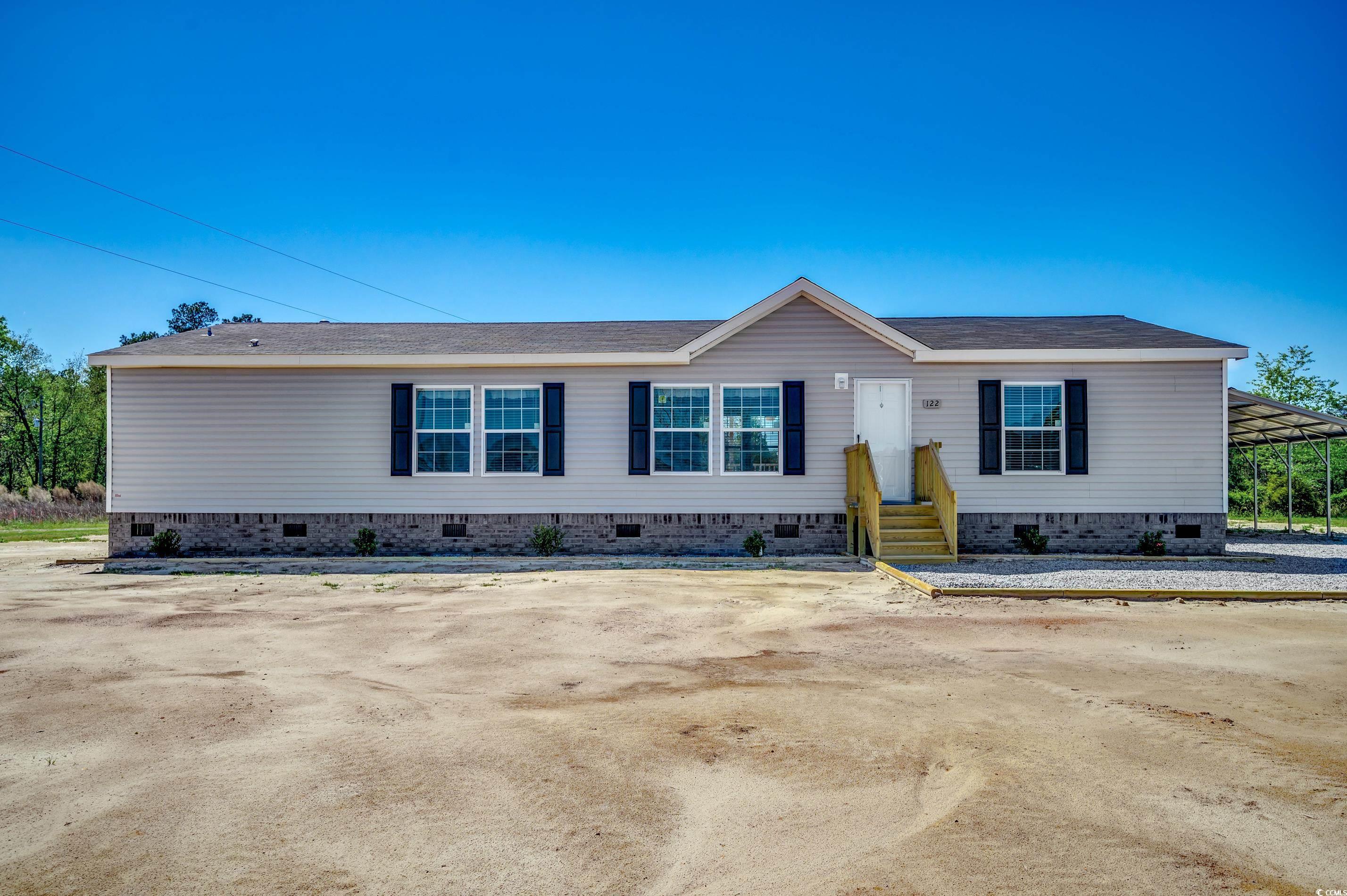 3 BR 2 Bath with Oversize Carport & Garage on 1/2