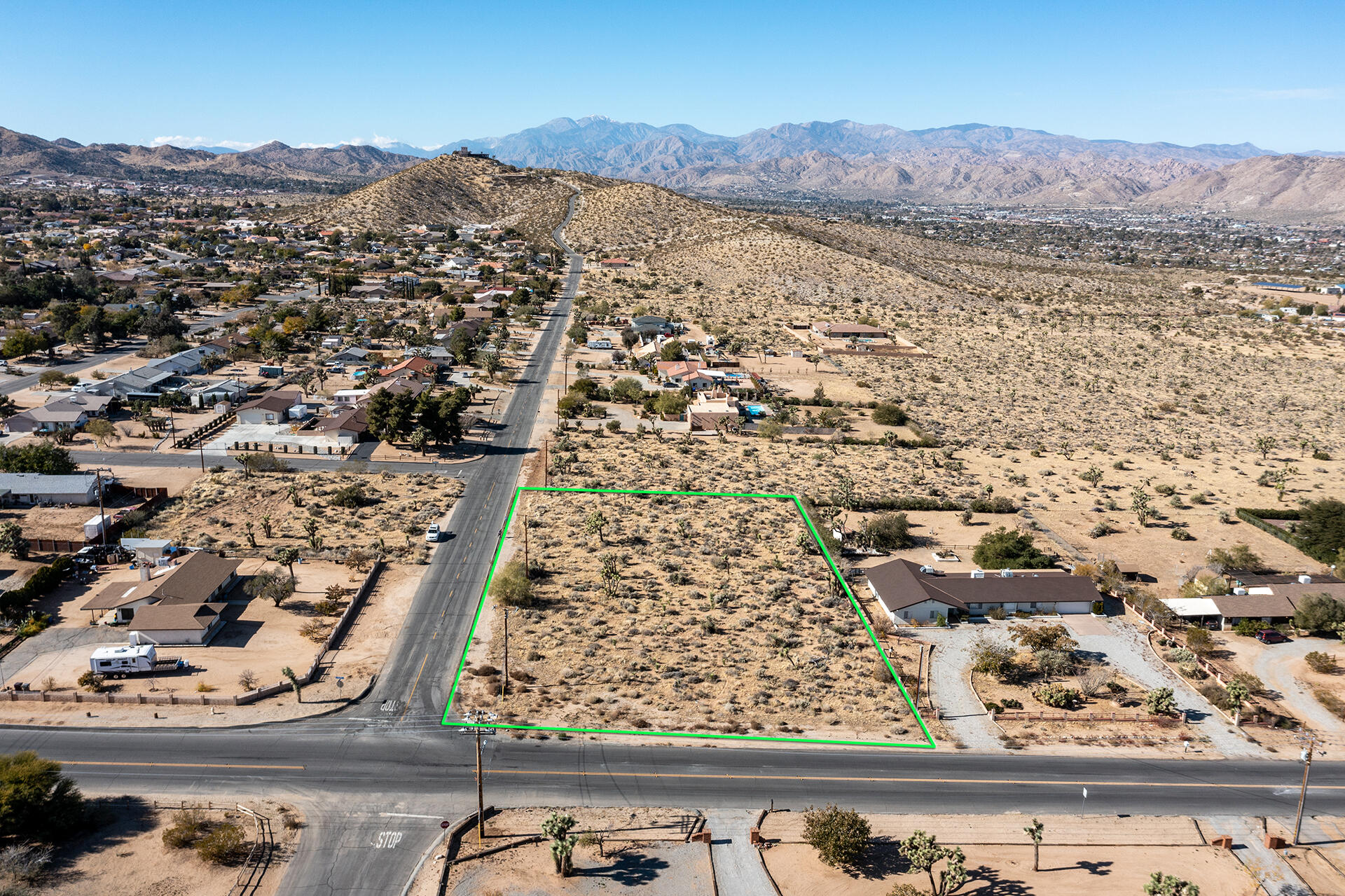 an aerial view of residential house and sandy dunes