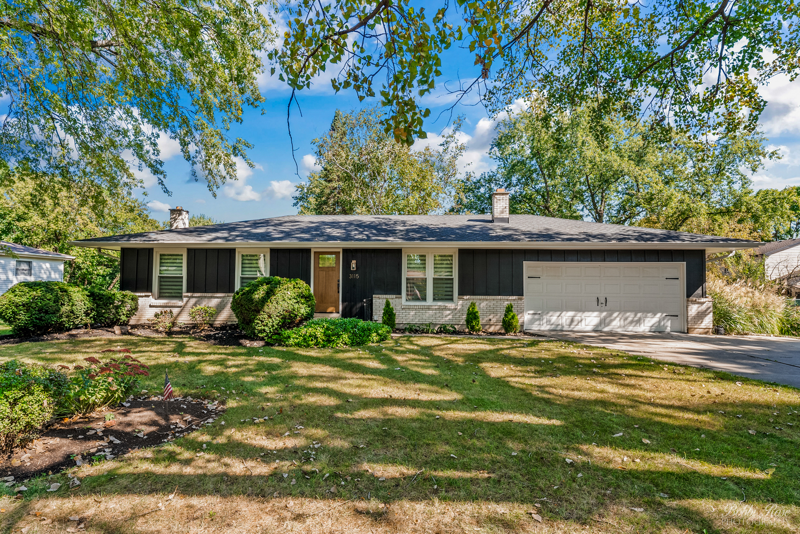 front view of a house with a yard