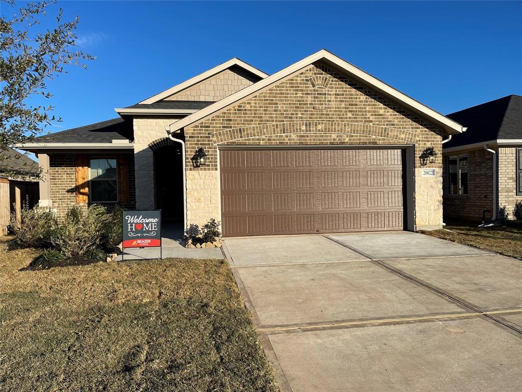 a front view of a house with garage