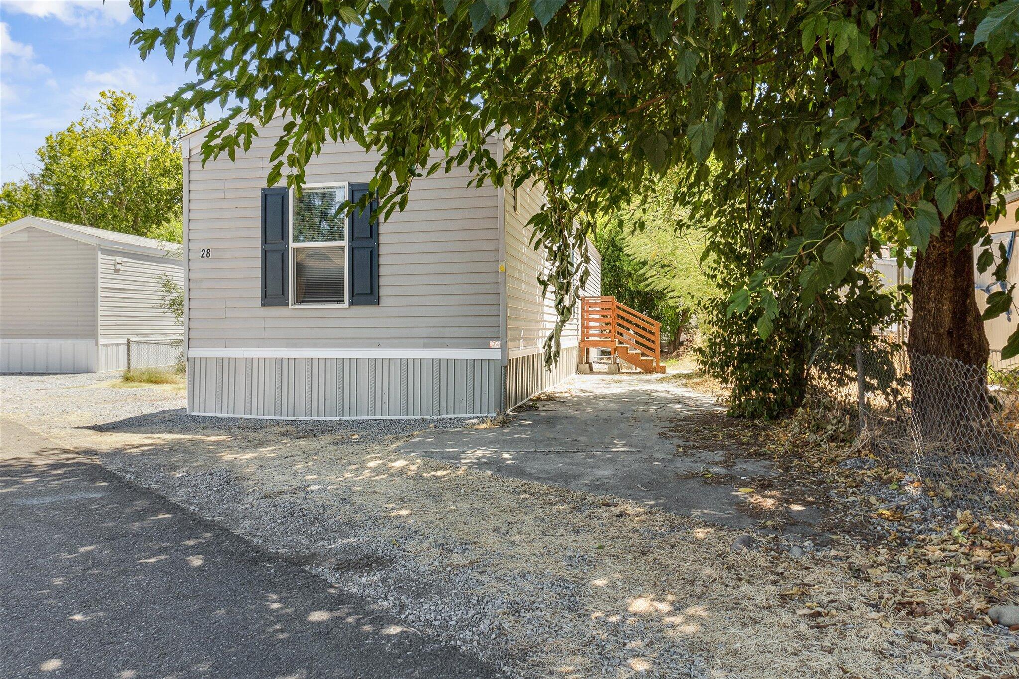 a view of a house with a yard and garage