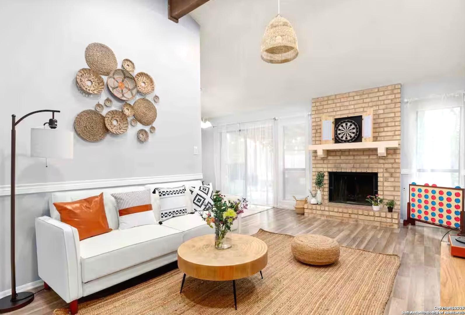 a living room with furniture and a fireplace