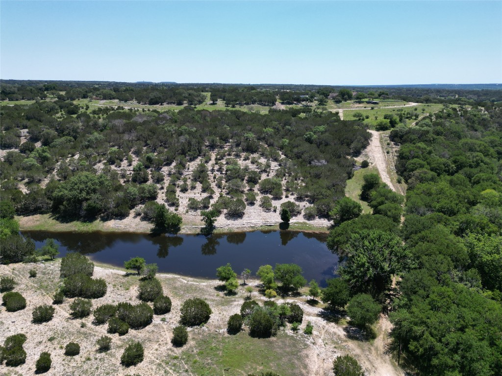 an aerial view of a house with a lake view